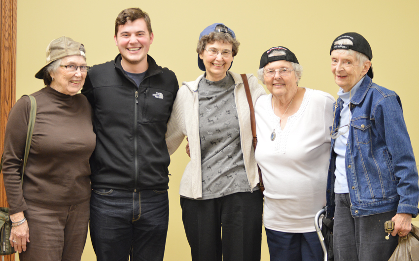 BIBLE STUDY - University of Nebraska-Lincoln sophomore Eric Zimmerman, a member of the St. Thomas Aquinas Newman Center, recently started leading a Bible Study at The Legacy Retirement Communities where he works. Members of his group recently attended a “Community Night” at the Newman Center, complete with backward caps like Eric often wears. (SNR photo by Tess Wahlmeier)